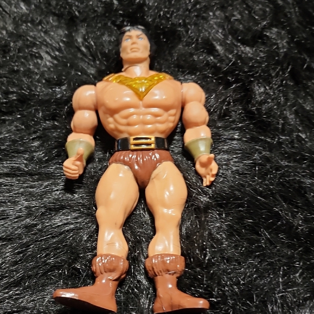 Action Figure with Gold and Brown Accents. Movable Head & Legs.